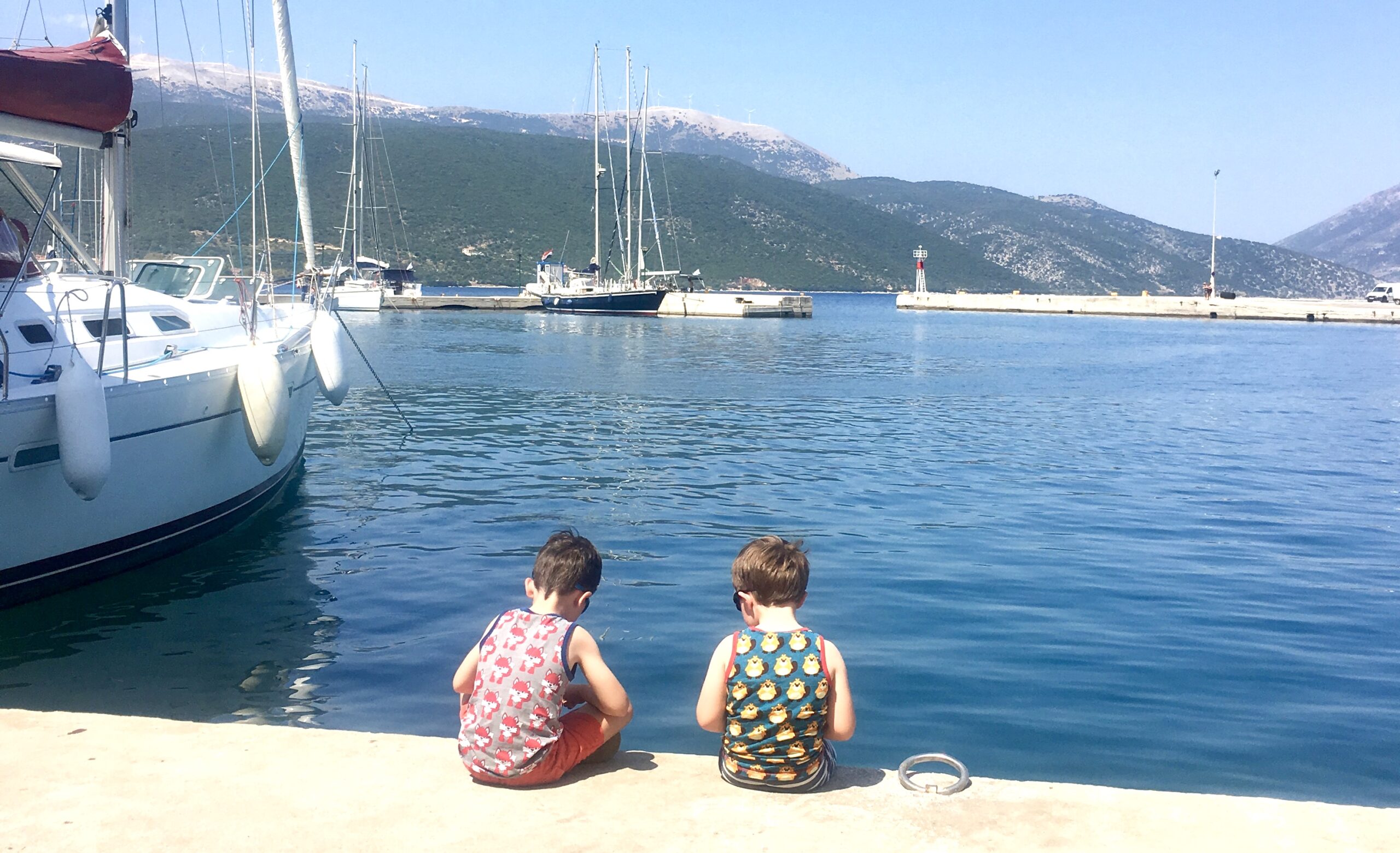 Two children looking out at the ocean
